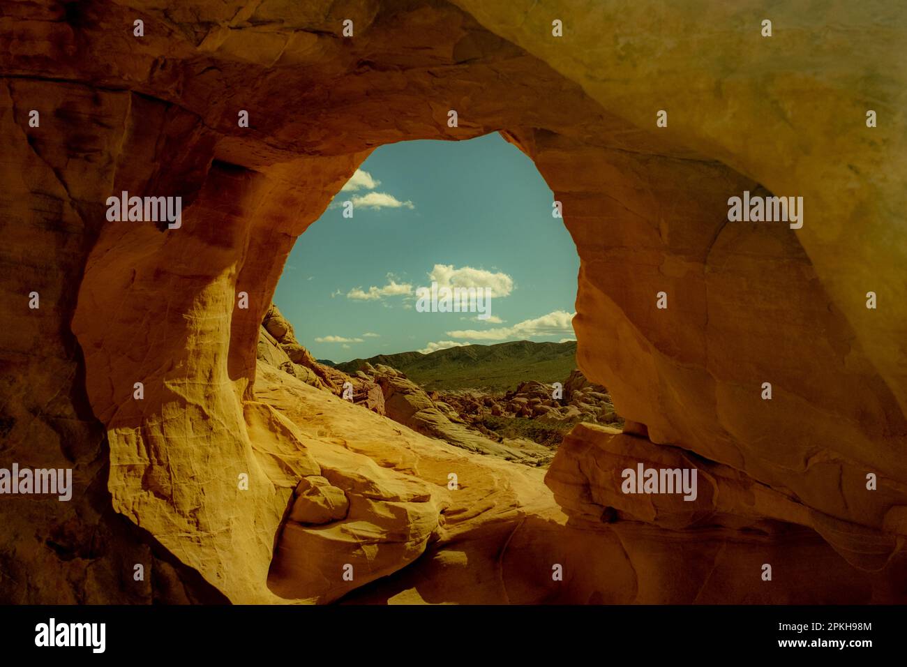 Looking through a hole in the rocks into the beautiful unknown Stock Photo