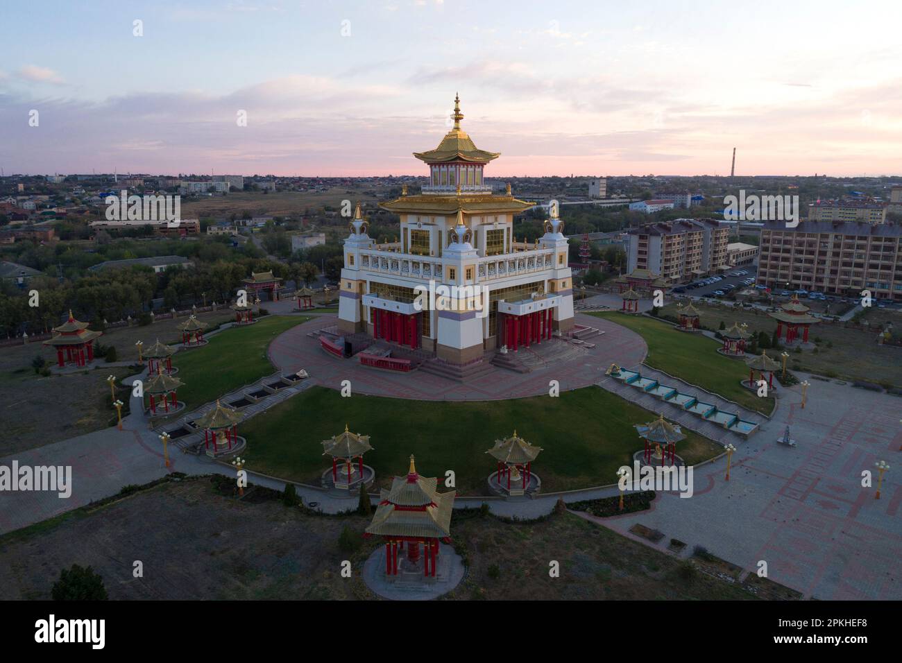 ELISTA, RUSSIA - SEPTEMBER 21, 2021: Buddhist temple 'Golden Abode of Buddha Shakyamuni' against the background of September dawn (aerial view). Repub Stock Photo