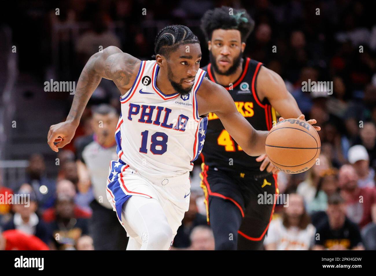 Philadelphia 76ers guard Shake Milton, left, drives down court past ...