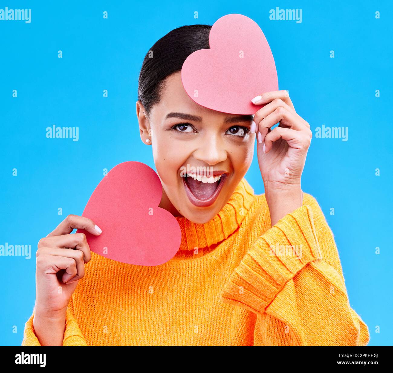 Paper heart, excited woman and surprise on blue background, studio and ...