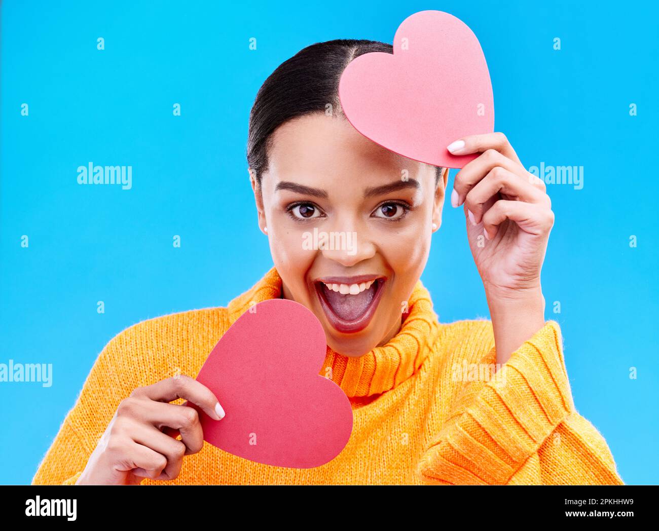 Paper heart, excited woman and portrait on blue background, studio and ...
