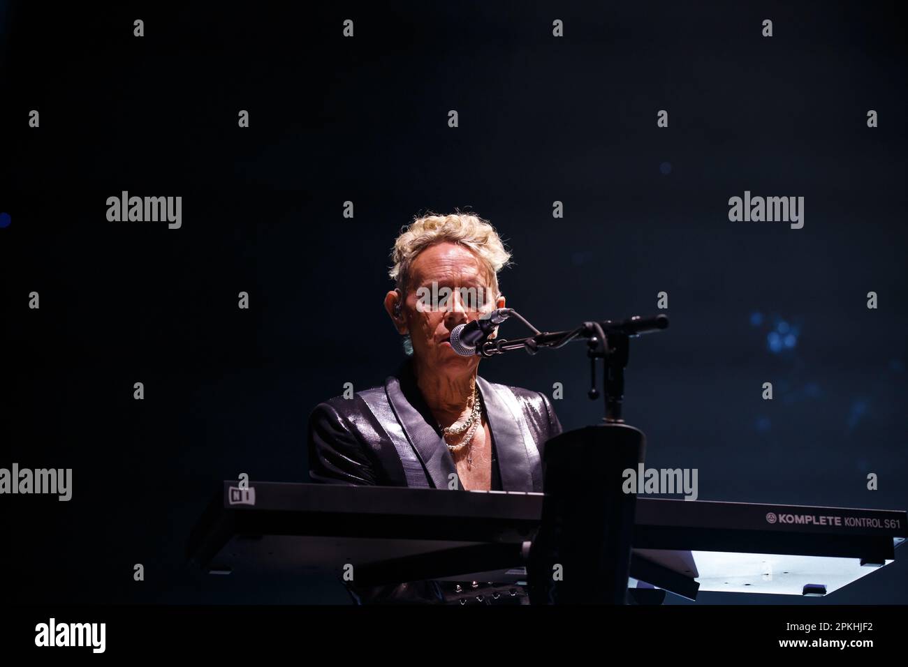 Martin Gore of Depeche Mode playing keyboards and singing on stage