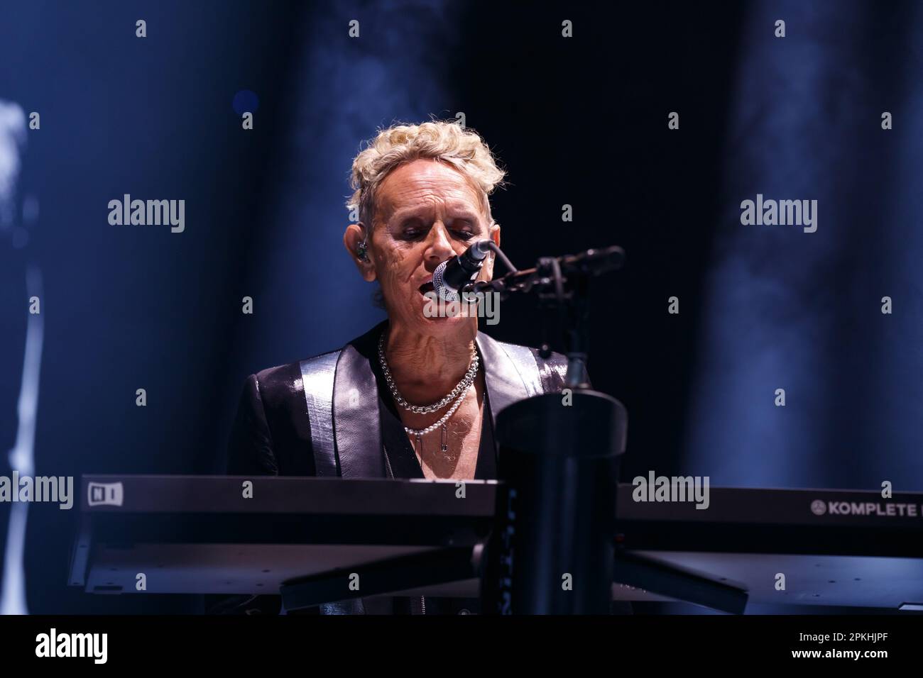 Martin Gore of Depeche Mode playing keyboards and singing on stage