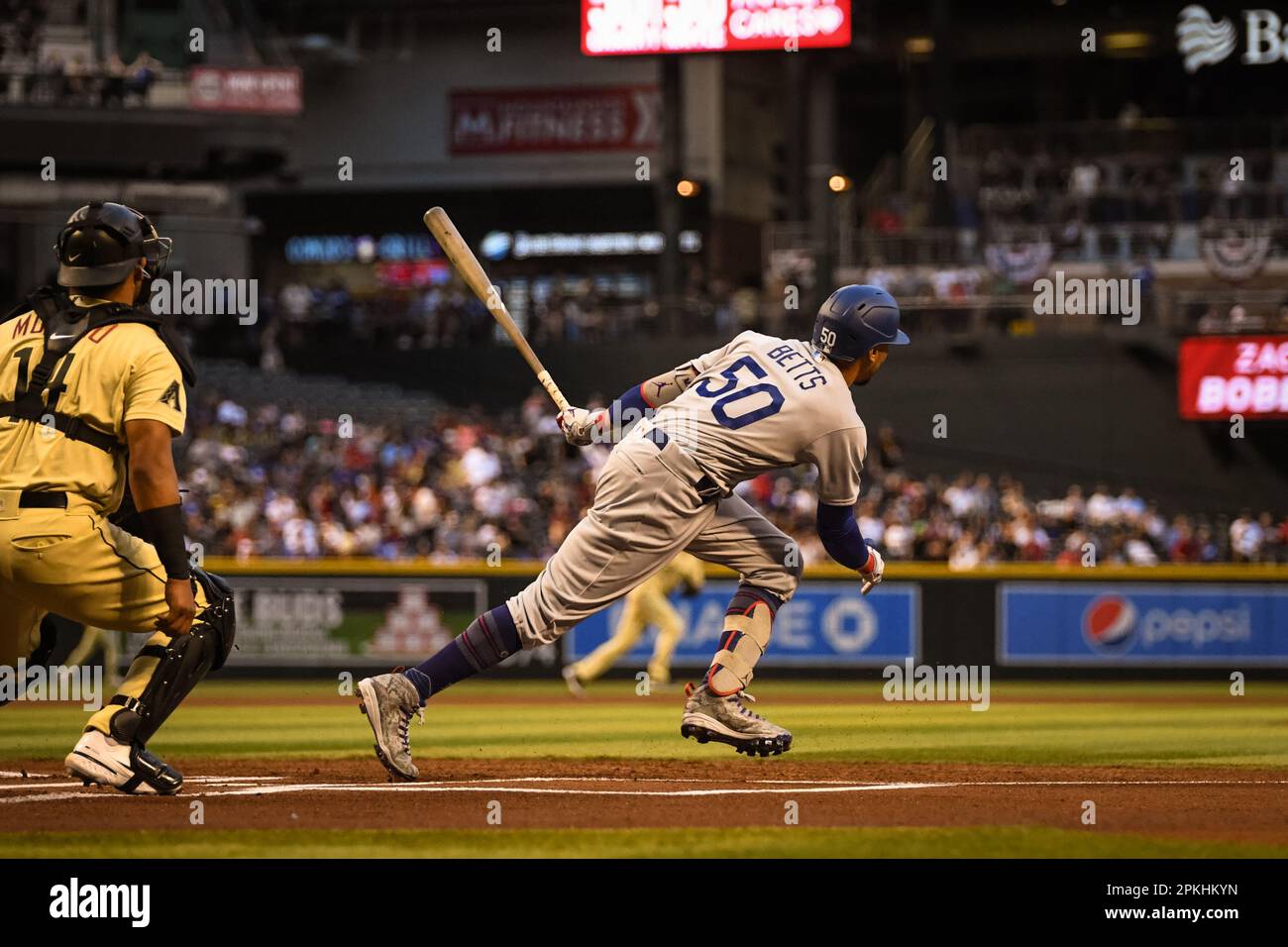 Los Angeles Dodgers right fielder Mookie Betts (50) doubles on a sharp