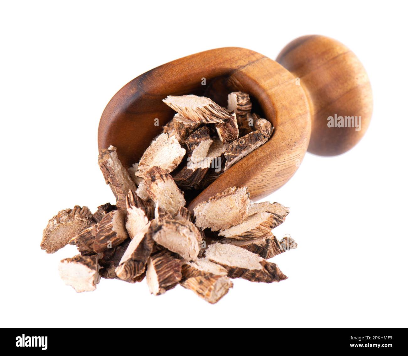 Calamus root in wooden scoop, isolated on white background. Sweet flag, sway or muskrat root. Dry root of Acorus calamus Stock Photo