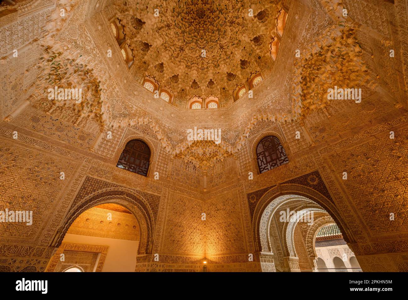 Muqarnas in dome and ceiling of Hall of the Abencerrajes in Nasrid Palace. Breathtaking layers of textures tessellating shapes, forms. Stock Photo