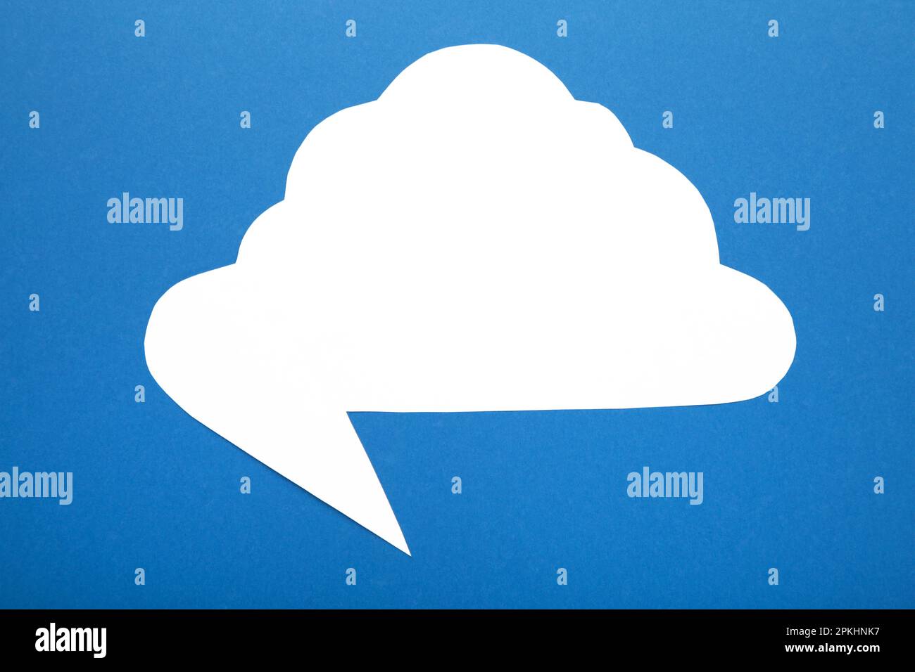 White paper speech bubble on blue background. Top view Stock Photo