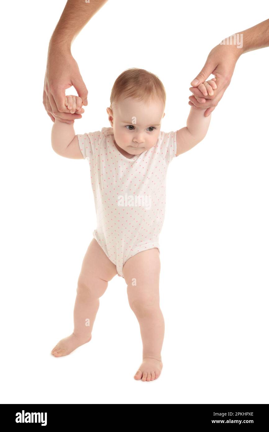 Smiling child walking hand in hand with father on white background Stock Photo