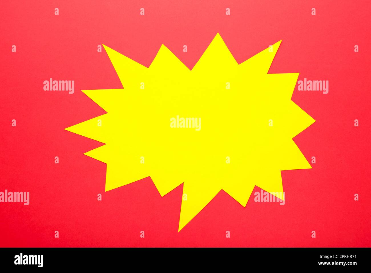 Yellow paper speech bubbles on red background. Top view Stock Photo