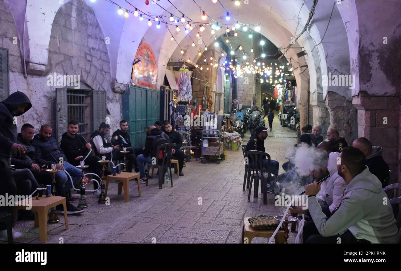 Palestinians smoke hookah pipes after the break of Ramadan fast as they ...