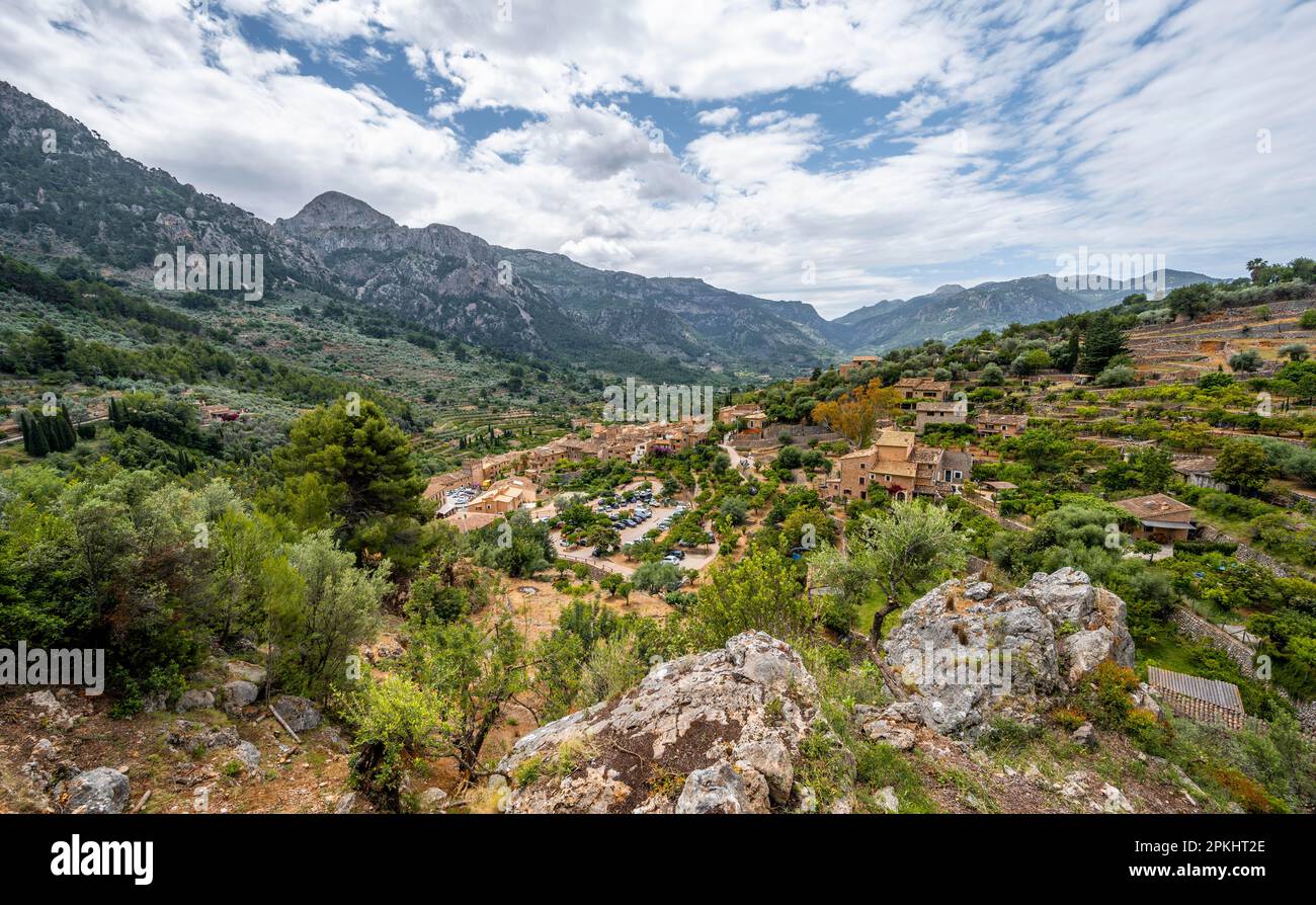 View of typical houses of the mountain village Fornalutx with mountain landscape, Serra de Tramuntana, Majorca, Balearic Islands, Spain Stock Photo