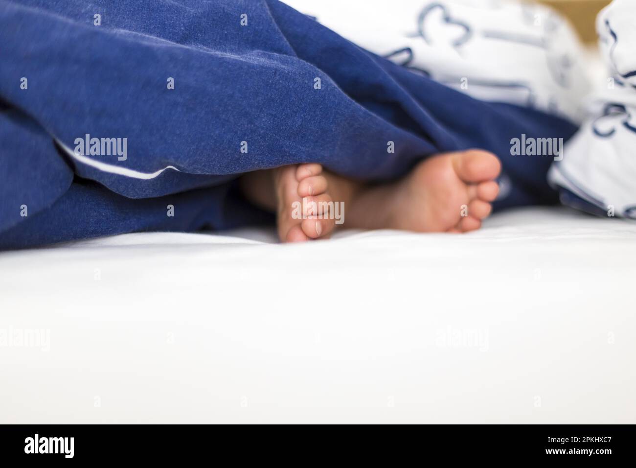 Childrens feet in bed, Kiel, Germany Stock Photo Alamy