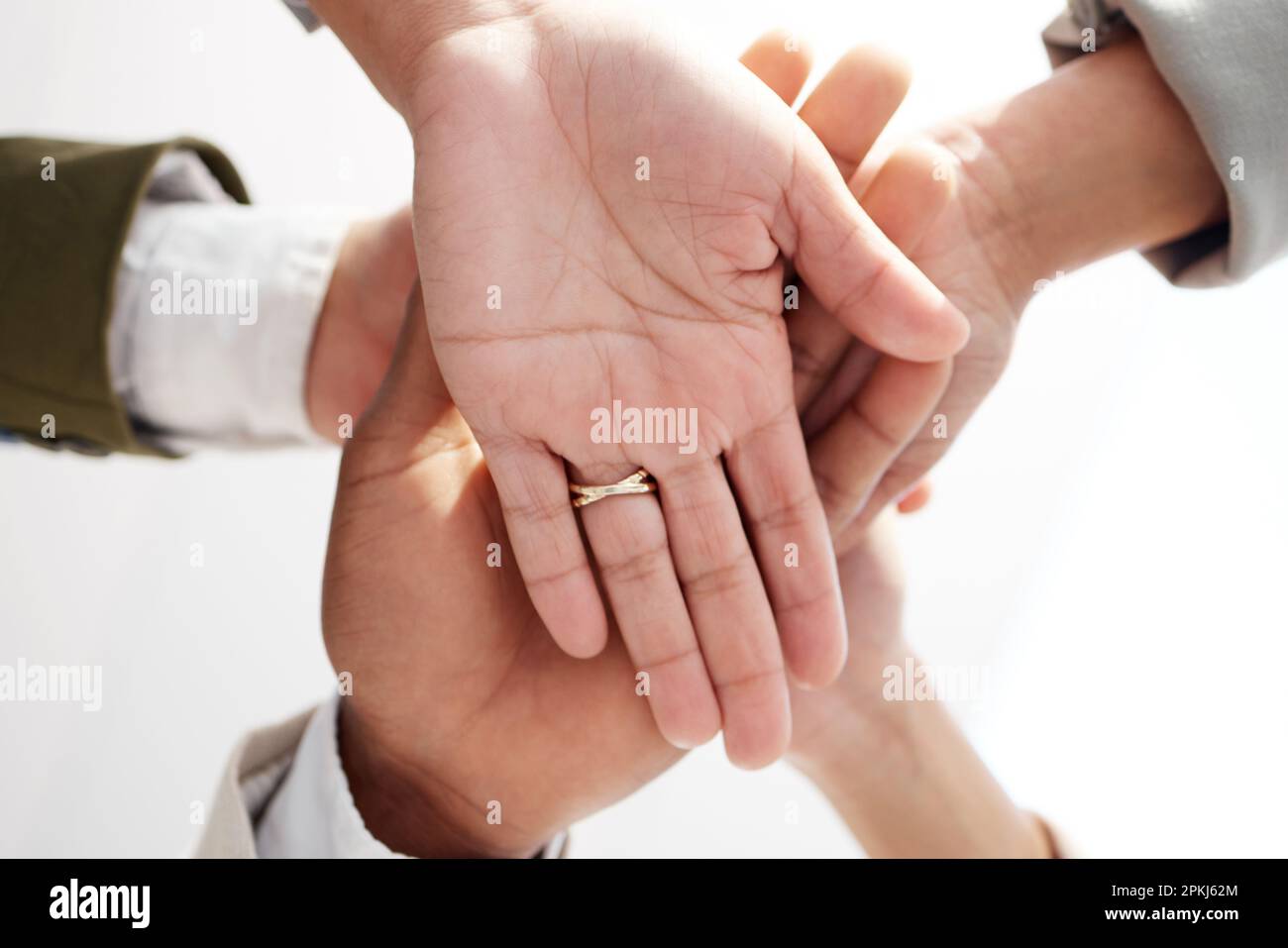 Teamwork, closeup and hands stacked of support, target or team building ...