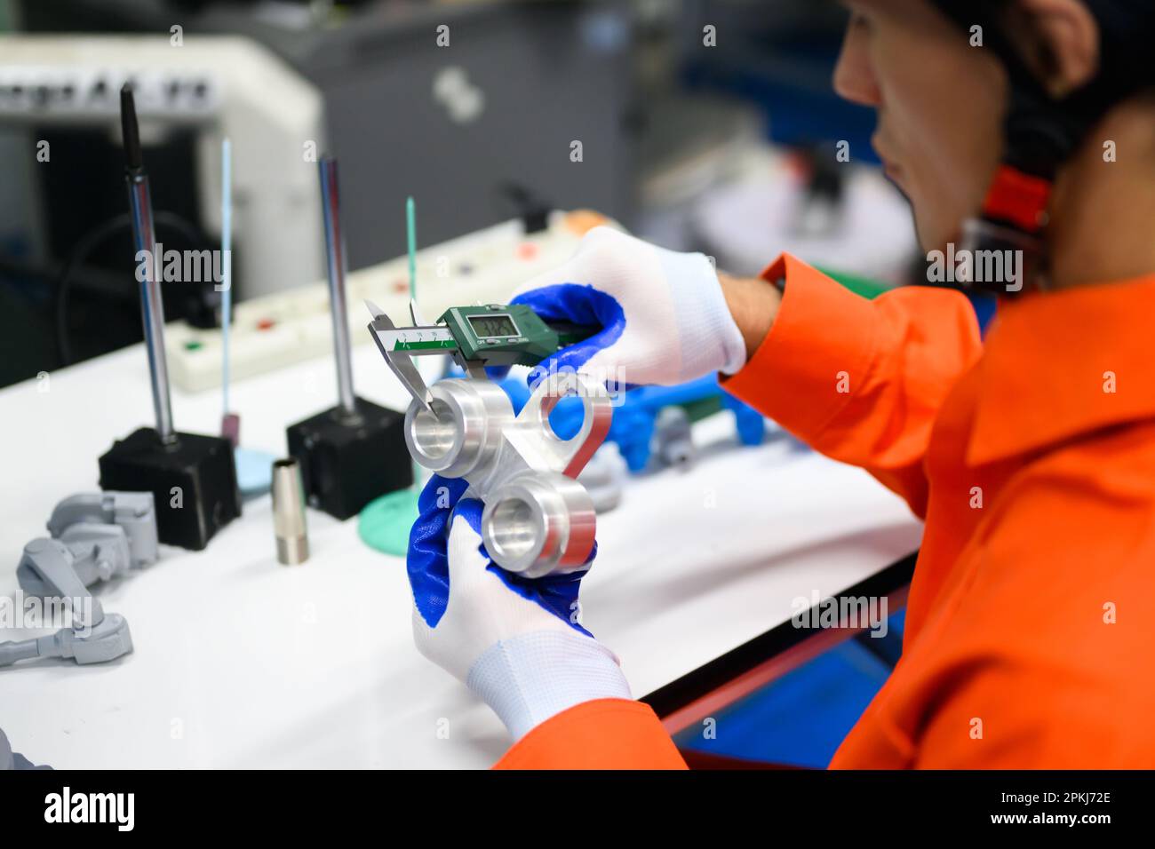 Industrial engineers workers working and checking machine factory Stock Photo