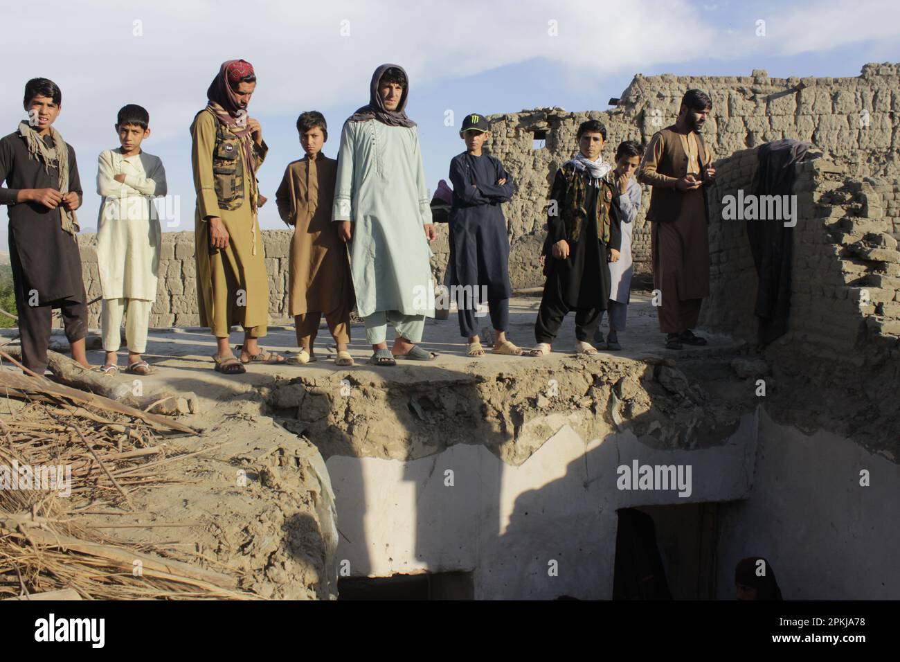 Laghman, Afghanistan. 7th Apr, 2023. Local people gather near a collapsed mud house in Alishing district of Laghman province, Afghanistan, April 7, 2023. Seven members of a family lost their lives as the roof of their house caved in on Friday in Afghanistan's eastern Laghman province, provincial director for Natural Disaster Management and Humanitarian Affairs, Qari Khair Mohammad Ghazi, said. Credit: Aimal Zahir/Xinhua/Alamy Live News Stock Photo