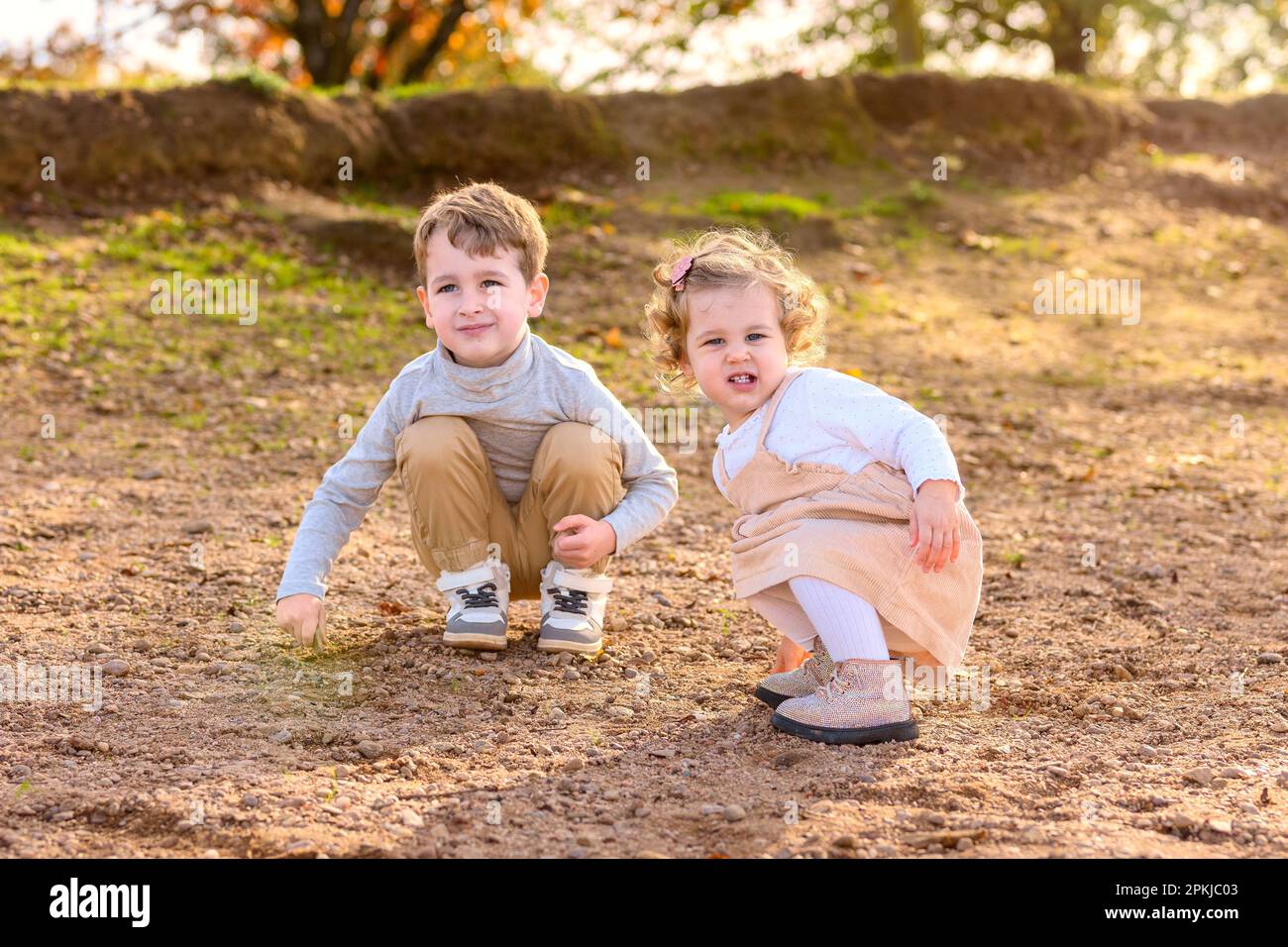 Brother and sister playing in the forest hi-res stock photography and ...