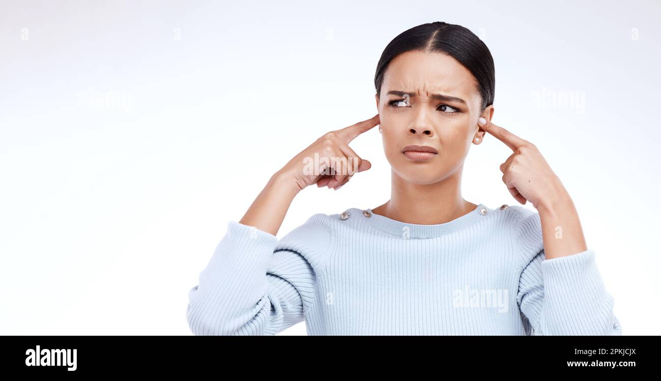 Annoyed woman and finger in ears for noise loud and denial gesture on Annoyed woman and finger in ears for noise loud and denial gesture on