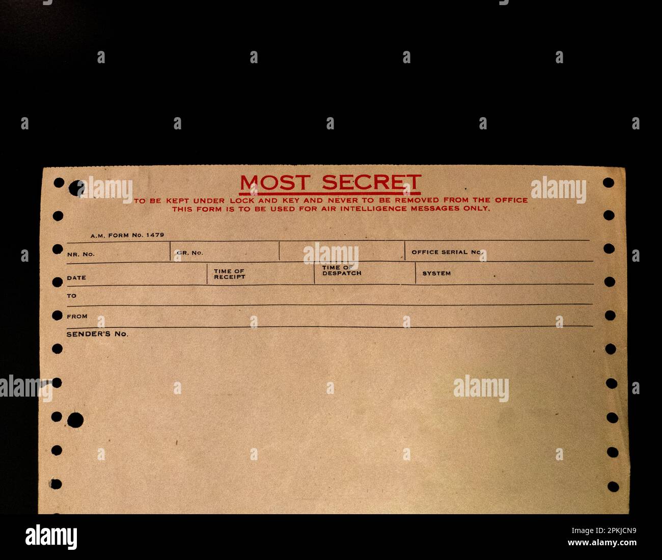 An old paper receipt (most secret) on a black desk surface Stock Photo