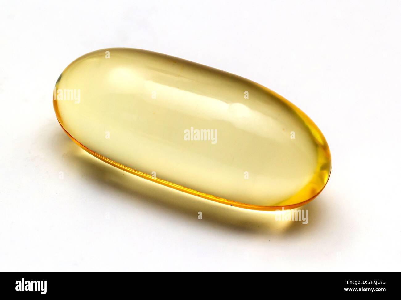 Fish oil capsules omega 3 on light background. Transparent yellow