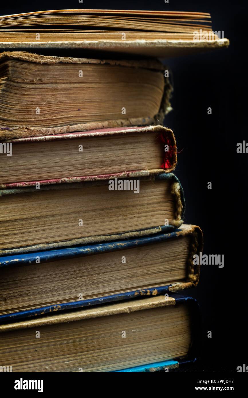 Book background. Stack of books in the library. Old yellow pages of ...