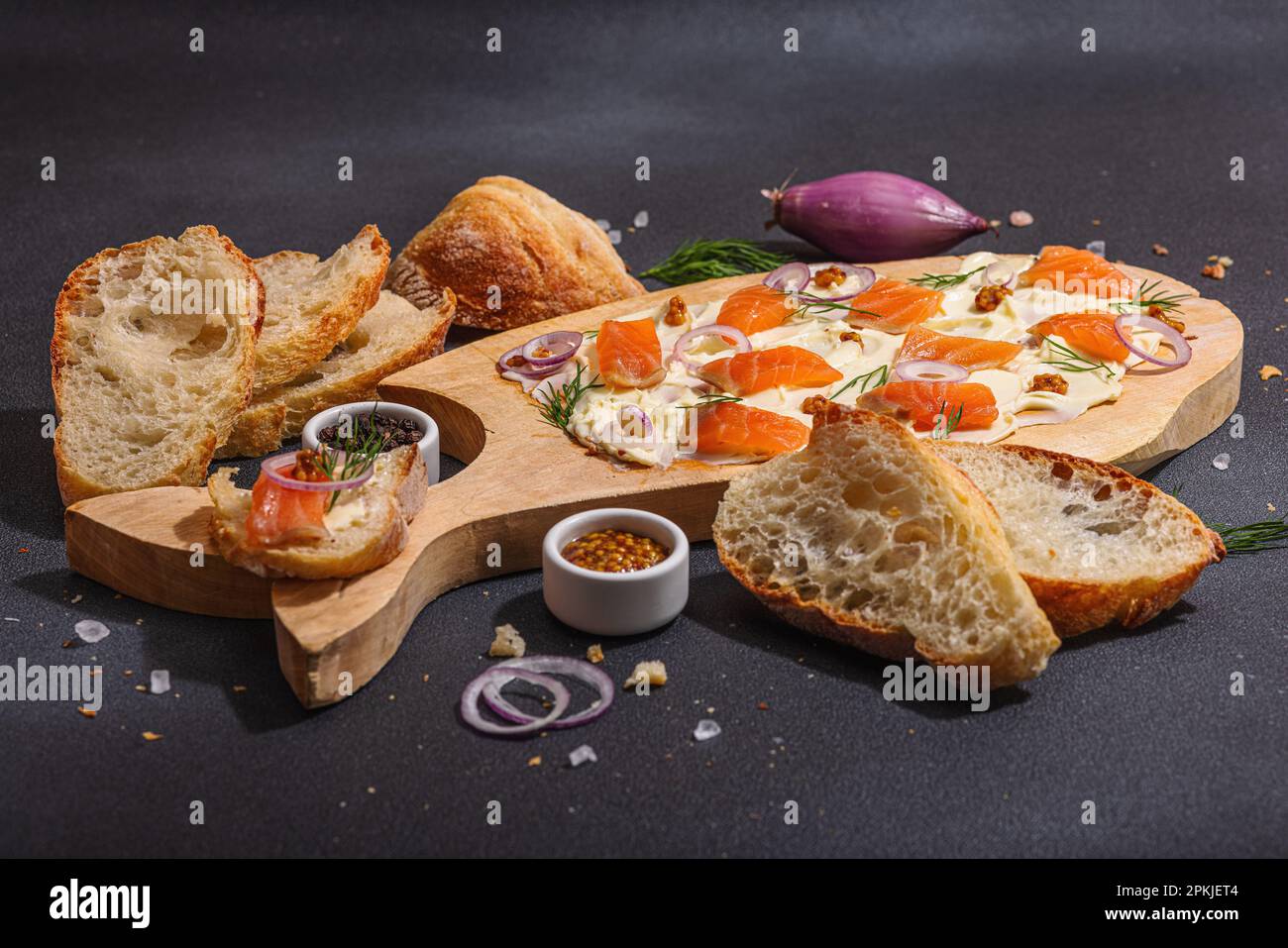 Butter Board food trend topped with salmon, shallots and fresh greens
