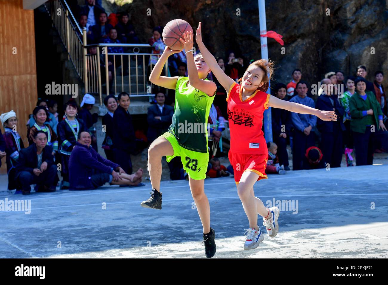 (230408) -- NANNING, April 8, 2023 (Xinhua) -- Villagers play basketball to celebrate the Spring Festival in Wuying village of Rongshui Miao Autonomous Prefecture, south China's Guangxi Zhuang Autonomous Region, Feb. 6, 2019. Basketball has long been popular in Wuying Village. In the past, the villagers played on a dirt court. The local government has been upgrading the infrastruture in recent years, including building a new basketball court of concrete. Now the sport becomes even more popular among the villagers, especially the kids. The village organizes basketball matches to celebrate festi Stock Photo