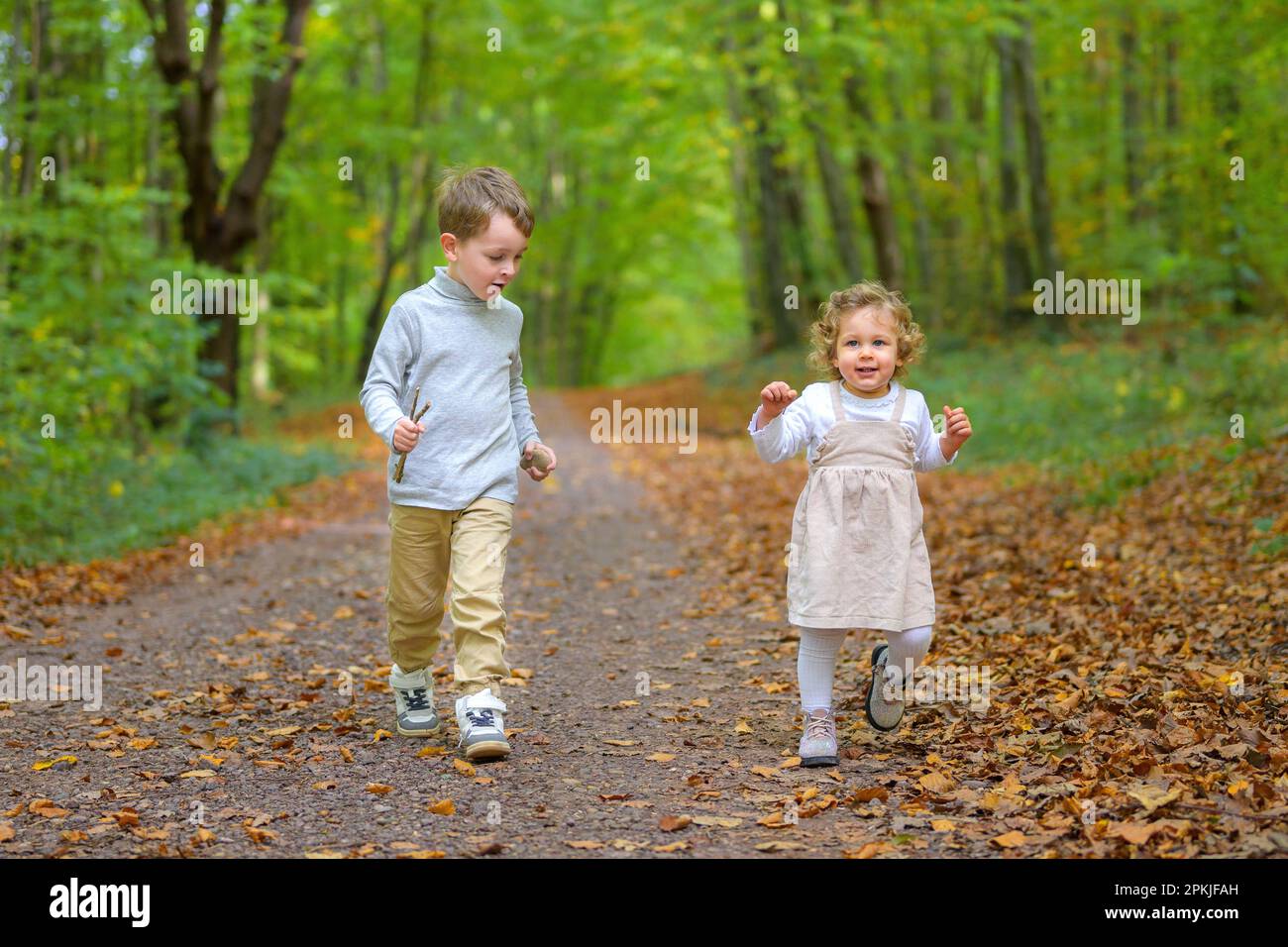Brother sister running in forest hi-res stock photography and images ...