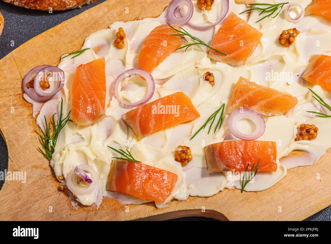 Butter Board food trend topped with salmon, shallots and fresh greens
