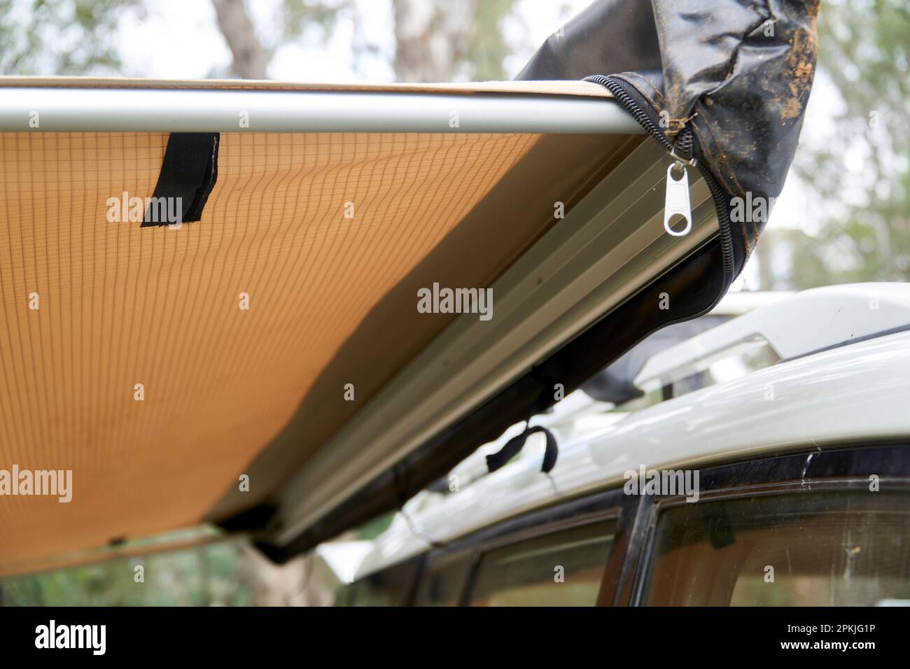Close ups of a extended side awning attached to a roof rack with quick release brackets, that allow for easy removal when not in use. Stock Photo