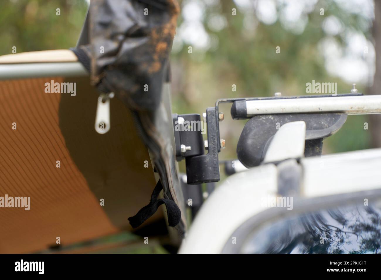 Close ups of a extended side awning attached to a roof rack with quick release brackets, that allow for easy removal when not in use. Stock Photo