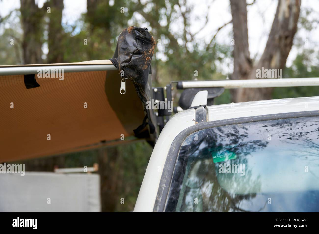 Close ups of a extended side awning attached to a roof rack with quick release brackets, that allow for easy removal when not in use. Stock Photo