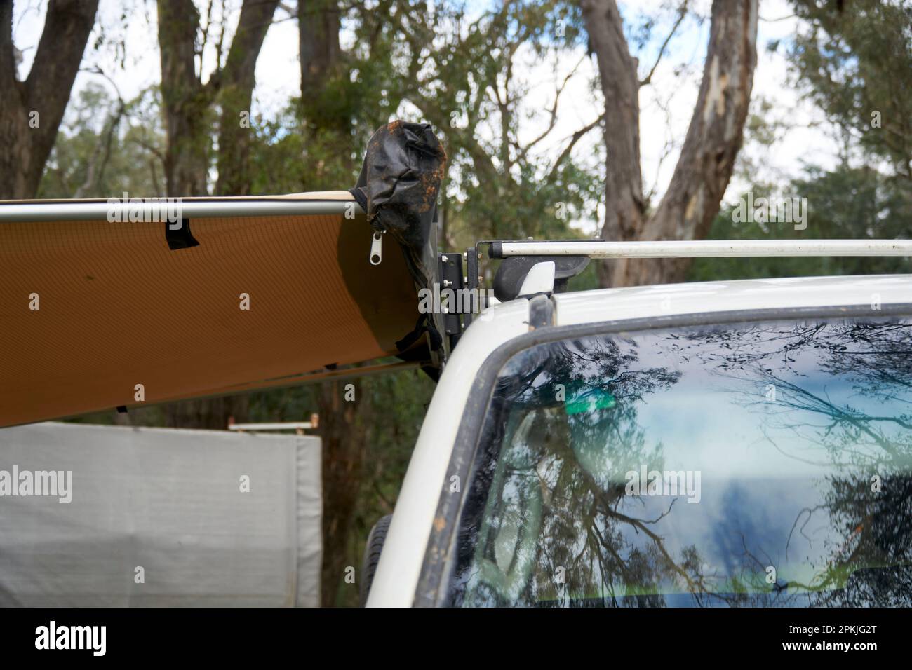 Close ups of a extended side awning attached to a roof rack with quick