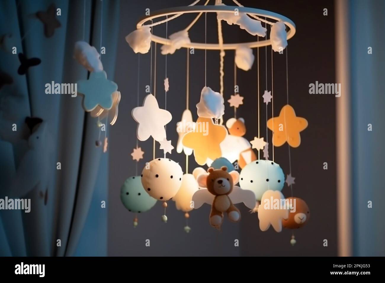 Handmade felt toys above the newborn crib with light garland in the