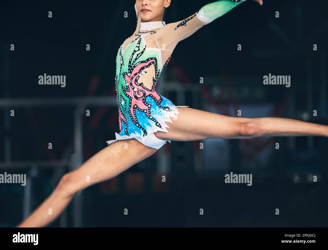 Gymnastics, fitness and zoom on woman jumping in arena for competition