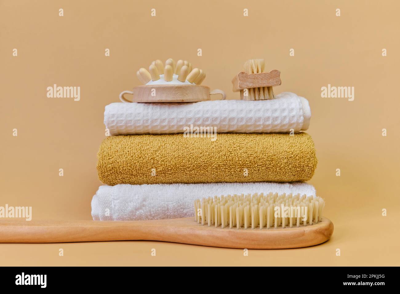 Natural bamboo massage brushes and towels for spa massage. Massage brush  with natural bristles on a terry towel. Home SPA concept, self care Stock  Photo - Alamy