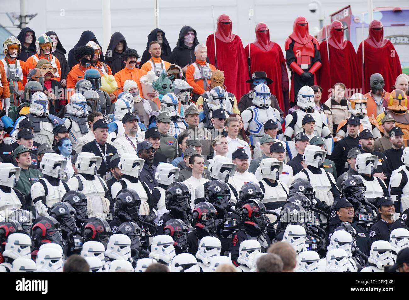 Visitors dressed in costumes pose for a group photograph during the
