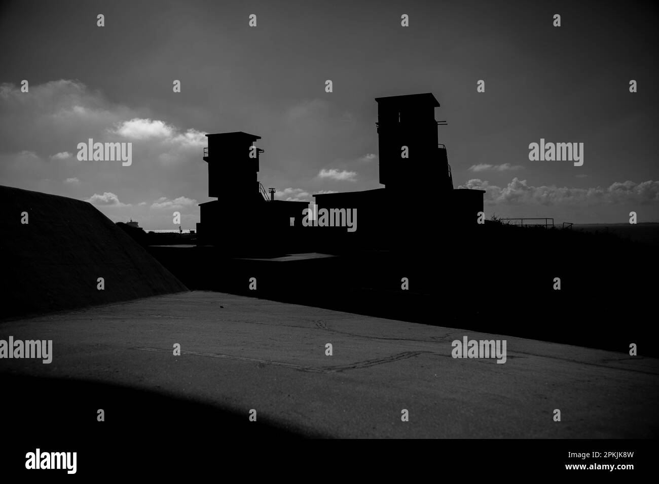 Ominously silhouetted defensive installations at Landguard Fort, Felixstowe Stock Photo