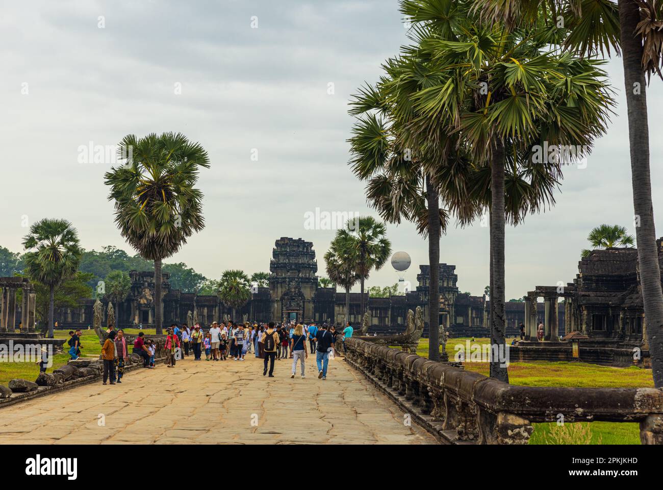 Tourists in Angkor Wat Temple Complex, the largest Religious Monument