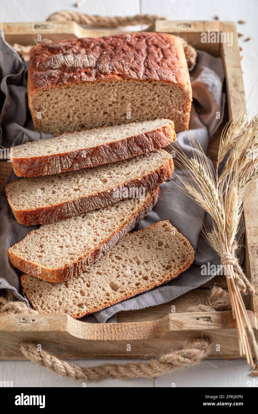 Multigrain loaf of breads with grain and ears. Rustic loaves of bread