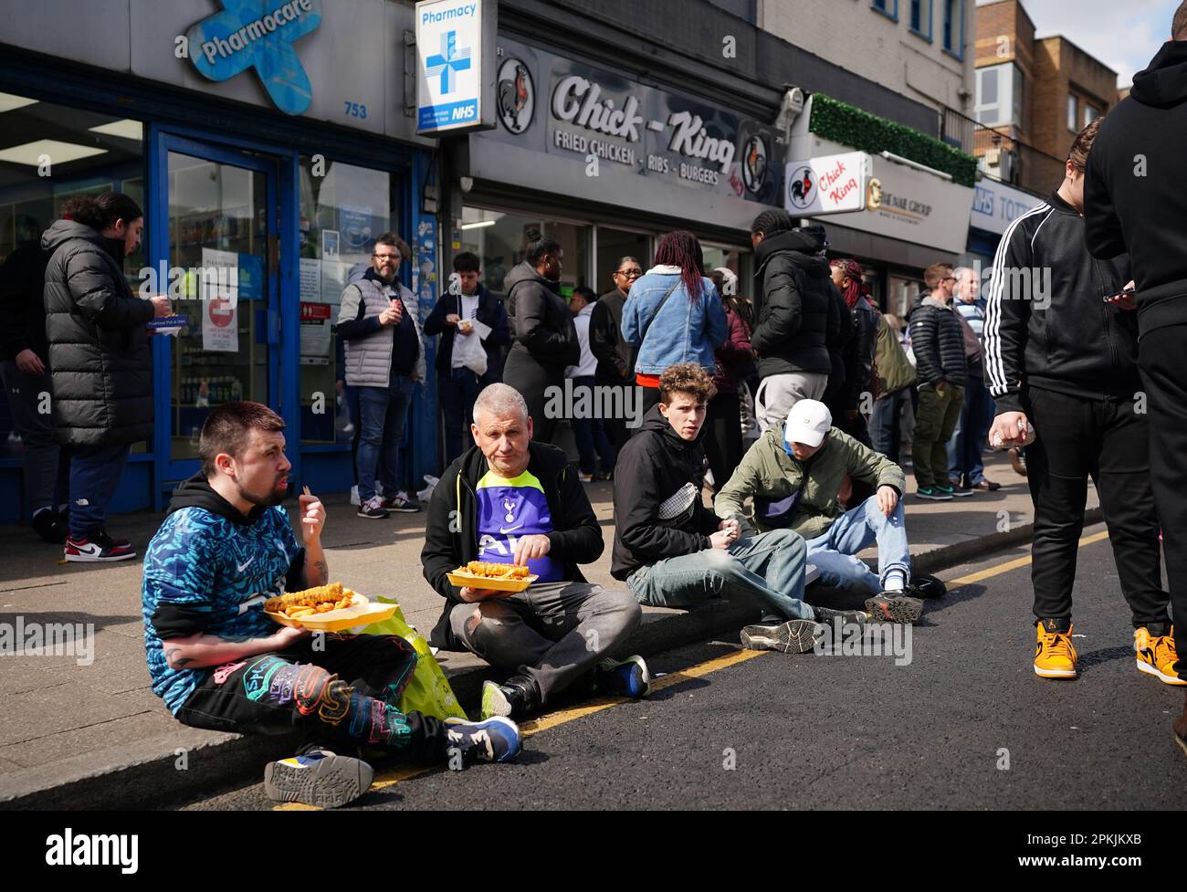 Fans enjoying fish and chips ahead of the Premier League match at the