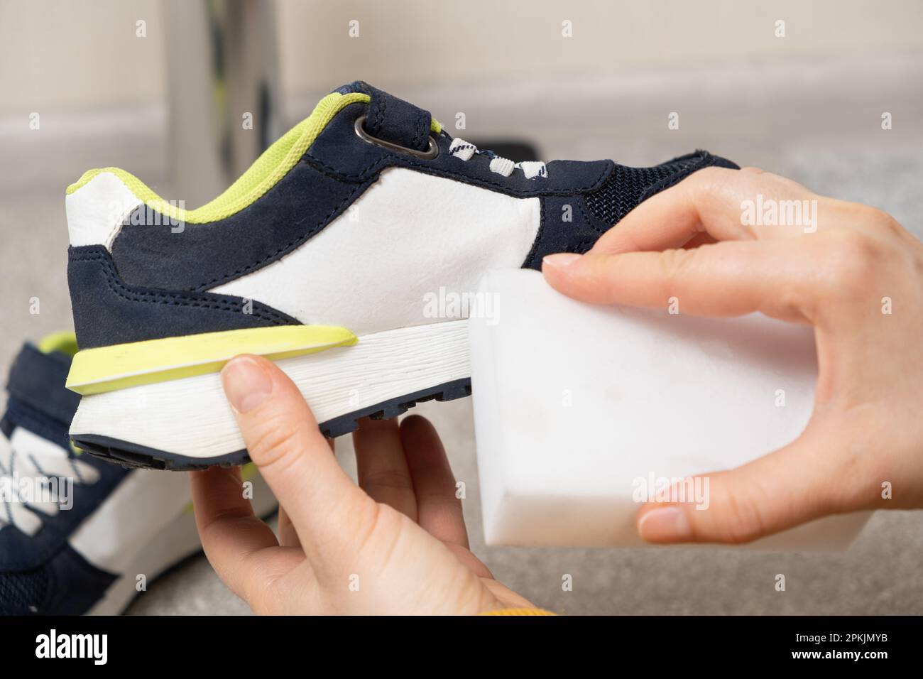 Cleaning of children's shoes, sneakers, soles from dust and dirt with a