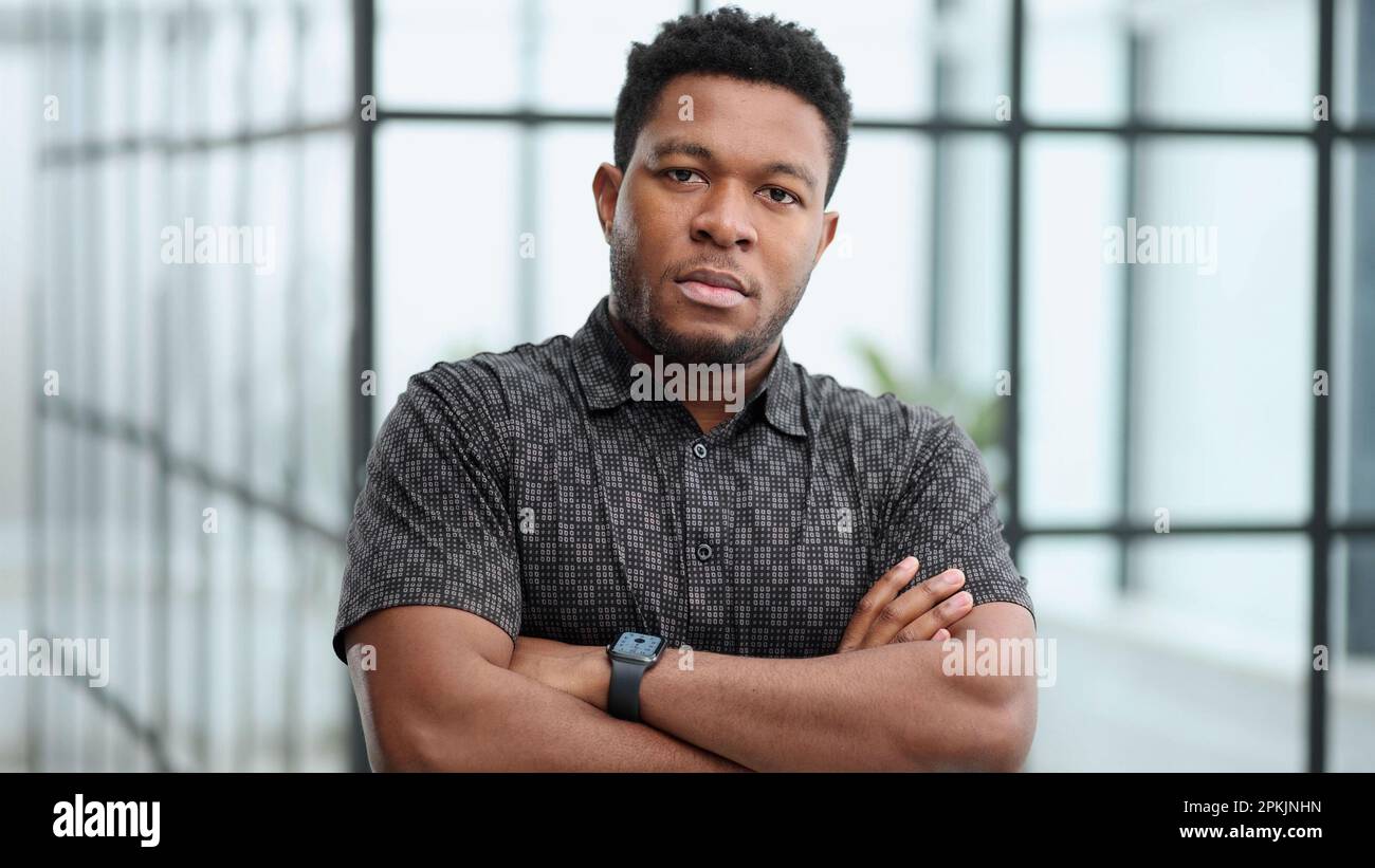 Serious dark skinned businessman has strict look Stock Photo