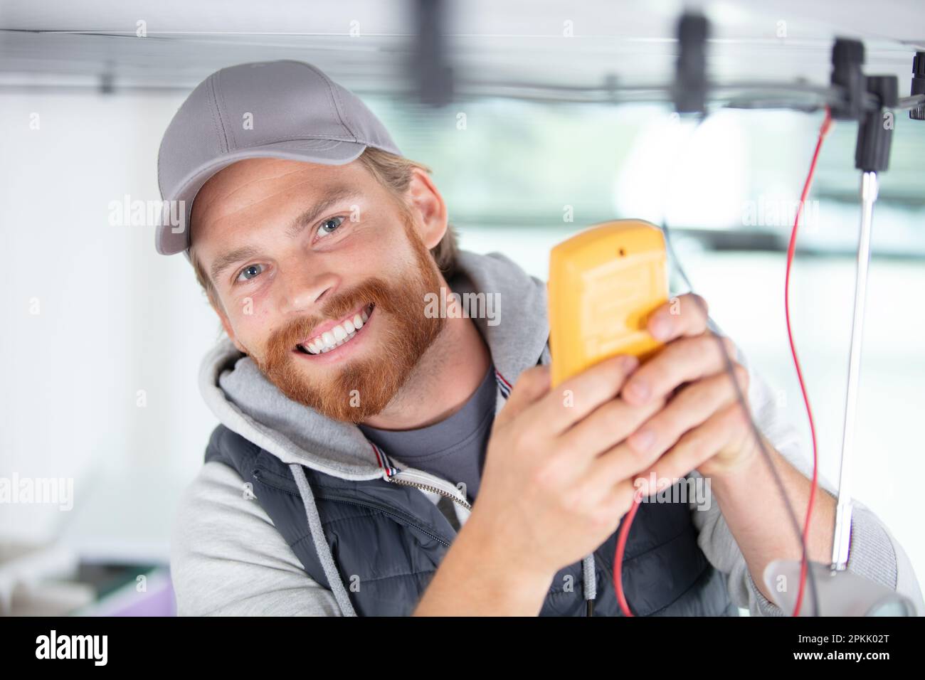 a electrician working in new building with cables Stock Photo Alamy