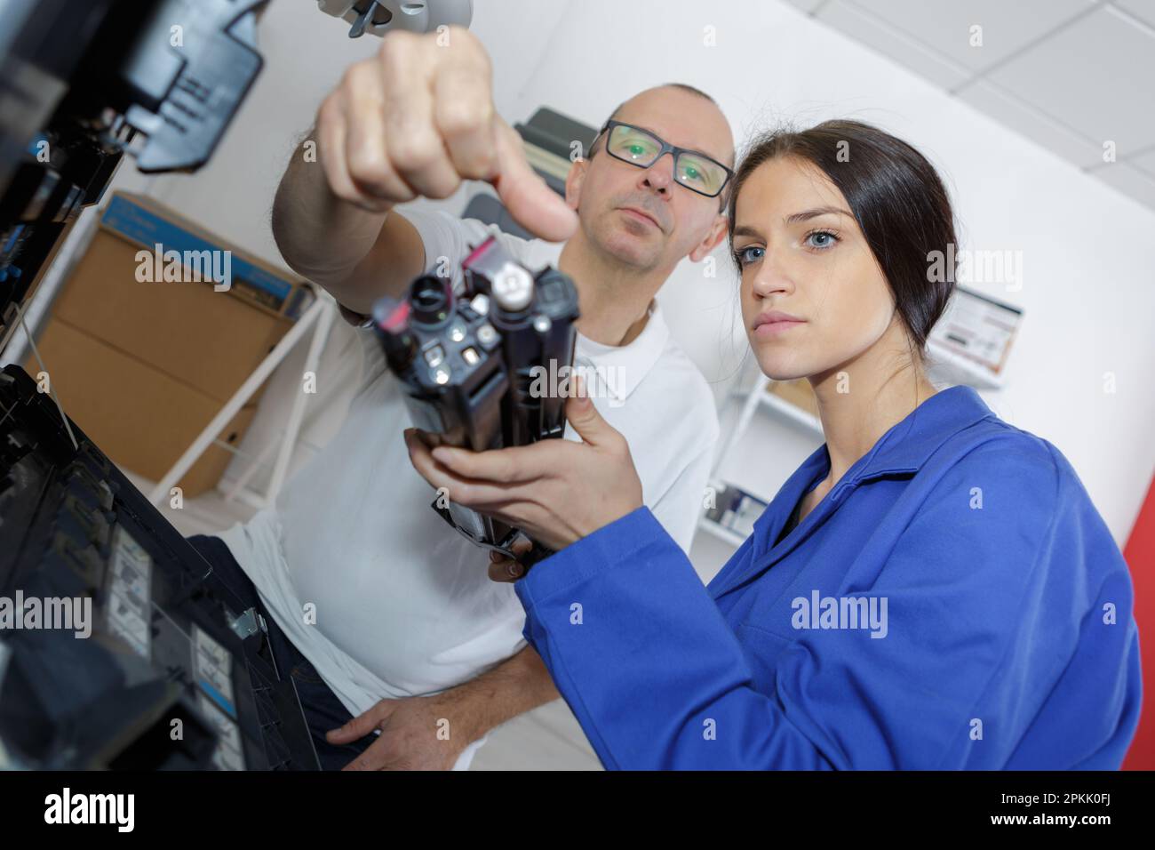 portrait of man and young woman at work Stock Photo - Alamy