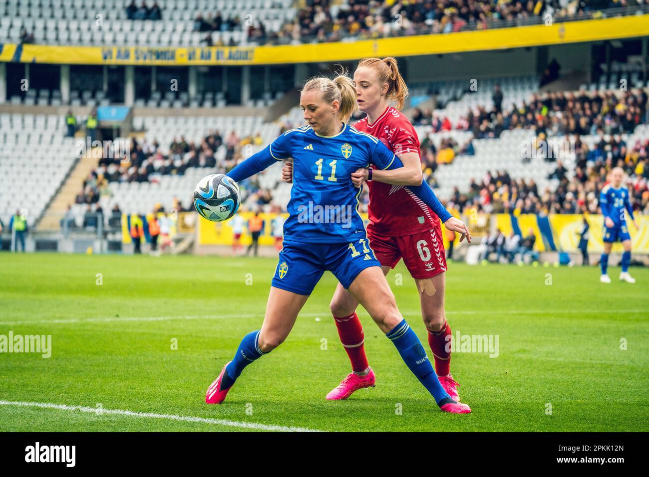 Malmoe, Sweden. 07th Apr, 2023. Stina Blackstenius (11) of Sweden and Karen Holmgaard (6) of Denmark seen during the football friendly between Sweden and Denmark at Eleda Stadion in Malmoe. (Photo Credit: Gonzales Photo/Alamy Live News Stock Photo