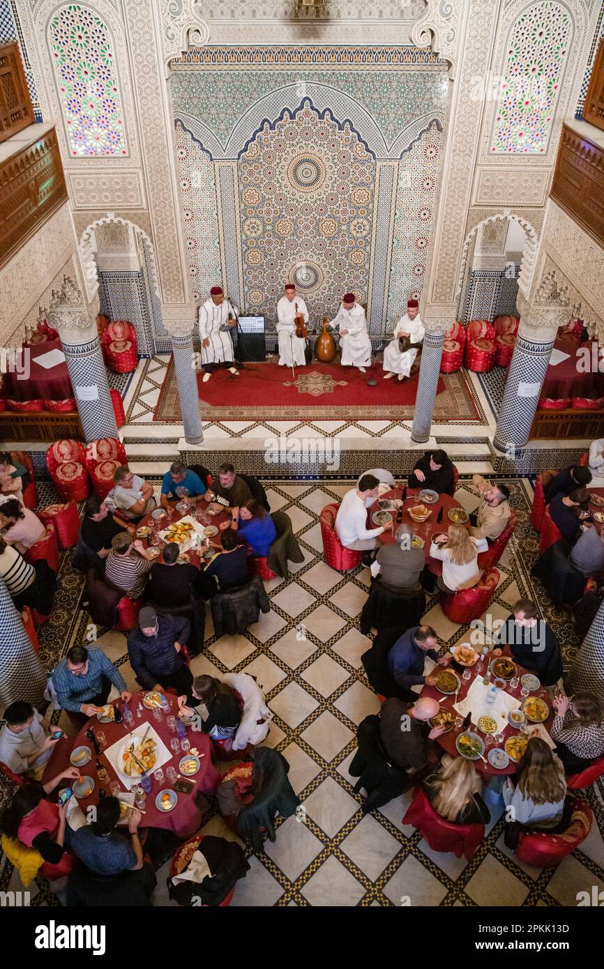 An overhead view of the busy dining room at Palais la Medina in Fez Morocco Stock Photo