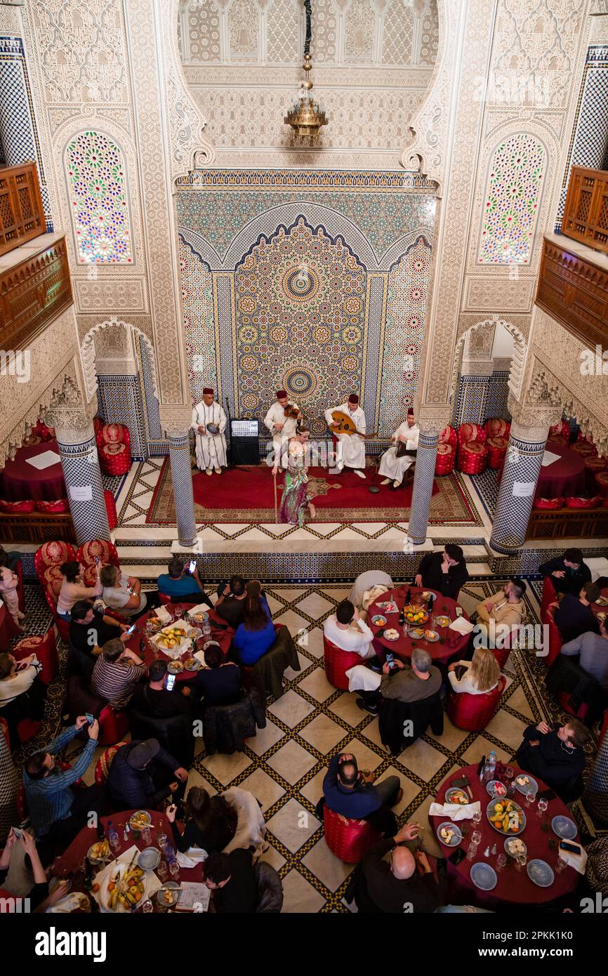 An overhead view of the busy dining room at Palais la Medina in Fez Morocco Stock Photo