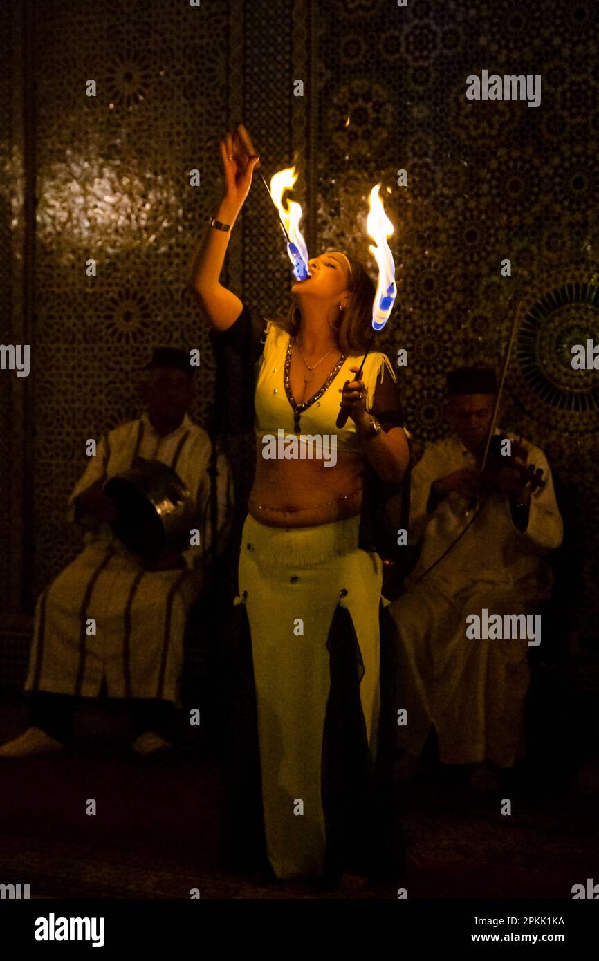 A fire eating belly dancer performs in Fez Morocco Stock Photo