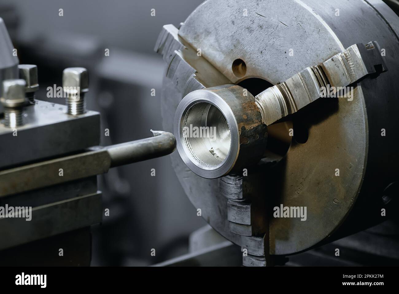 Type of metal processing lathe part. Industrial background Stock Photo