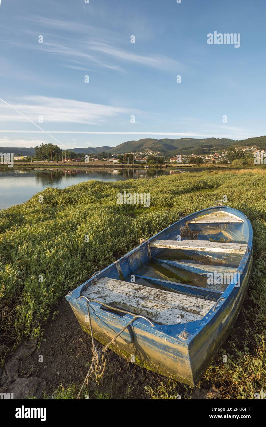 A small blue raft out of the water next to the sea Stock Photo - Alamy